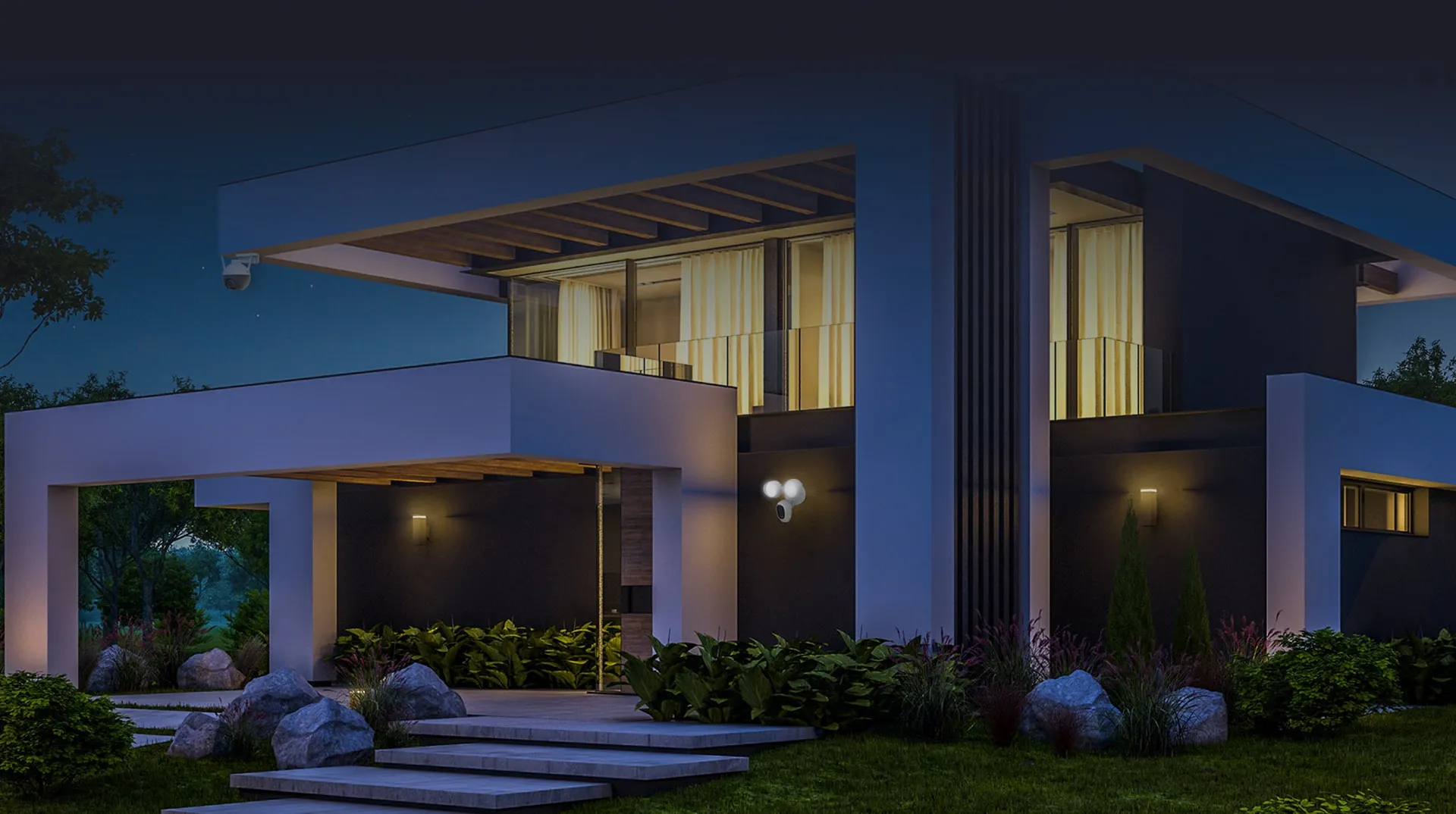 Modern house exterior protected by outdoor cameras at night