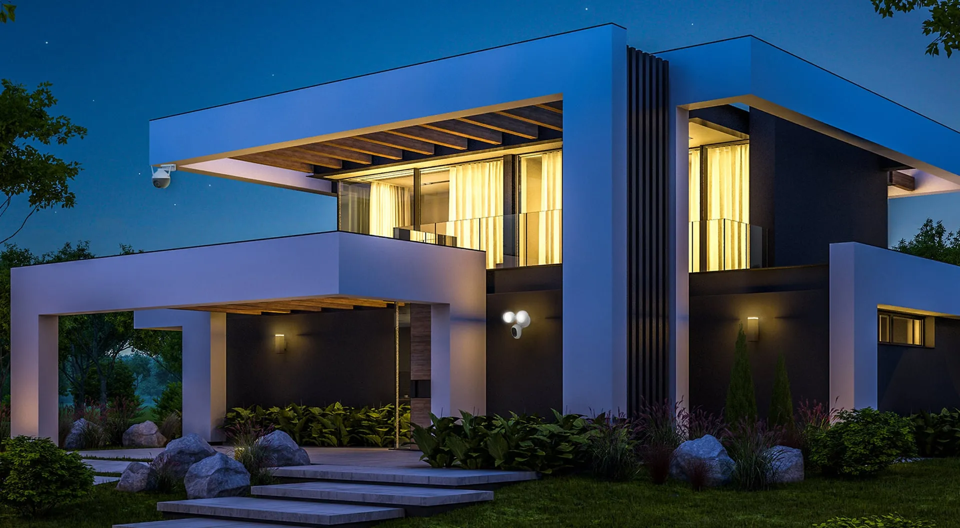 Modern home at night protected by ihsanX security cameras