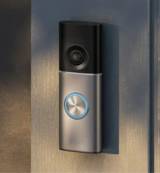 Smart video doorbell mounted beside a front door